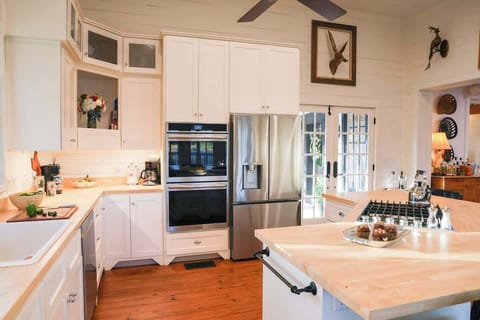 Main house kitchen with stainless steel appliances, including a double oven!