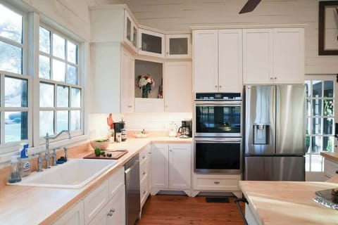 Main house kitchen area with stainless steel appliances, including a double oven!