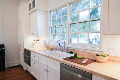 Kitchen area with large windows letting in lots of natural light!
