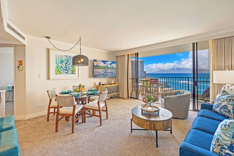 Relax and dine in Kaanapali Shores 903’s open living and dining space with tropical island vibes.