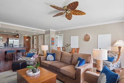 The inviting living room at Honua Kai - Konea 204 by Gather features updated island-style décor and plush comfort.