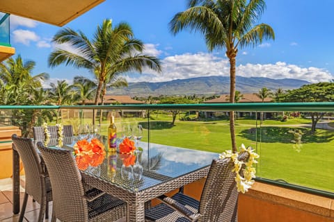 Enjoy your morning coffee on the lanai of Honua Kai Konea 206 with garden and ocean views.