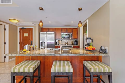 Hokulani 214 'Kamalu' features granite counters, a spacious island, and stainless Bosch appliances.