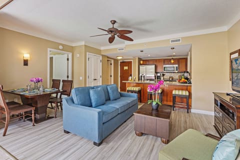 Relax at Hokulani 214 'Kamalu' where the open-concept living area flows into a stylish kitchen.