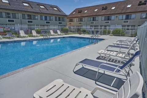 Lounge comfortably poolside with plenty of space to relax.