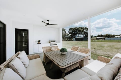 The BBQ, cool breezes and rural horizon come together to provide a transporting experience in the undercover patio. 