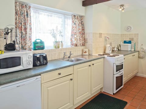 Base cupboards with electric cooker and under counter fridge