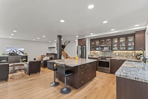 Large great room with 5 star kitchen and more