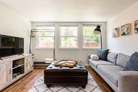 Comfortable West Elm couch with pillows to get cozy for a movie night