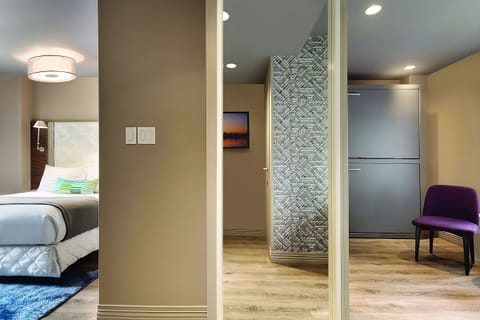 Enjoy skyline mornings from bed in a sunlit corner room.