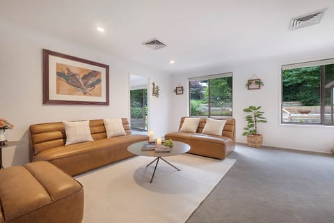 Relax and sink into comfy leather lounge sofas and ottaman.