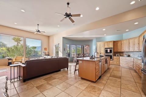 Open concept kitchen, dining and living area. Great for catching up!