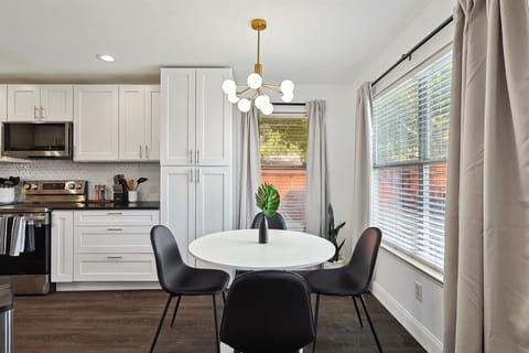 This adorable breakfast nook is stylish and posh, located only steps from the kitchen and with a beautiful view of the backyard!