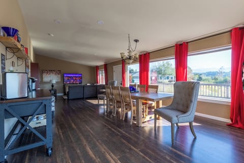 Front entrance with dining room, coffee bar, and living room area