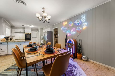 The kitchen & dining area with a jukebox for endless entertainment & Neon Lights