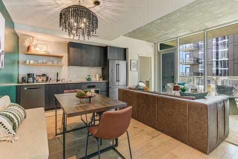 The moment you walk in, you are welcomed by the open living, dining, and kitchen
