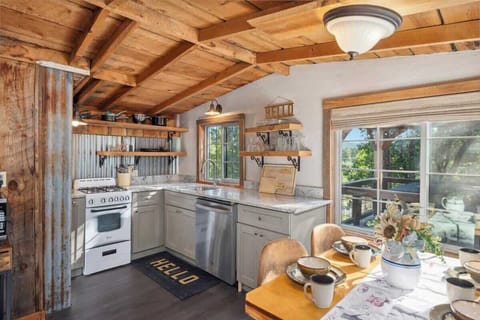 Fully Equipped Kitchen with Modern Appliances and Beverage Station