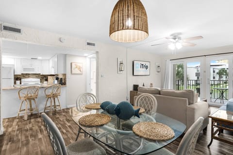 The dining room offers seating for four at the table and bar seating for two