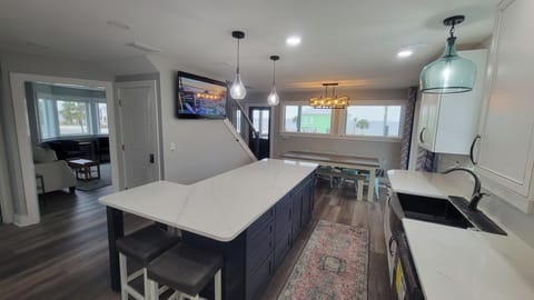 L Shaped Island that seats 6 or 7 guest.