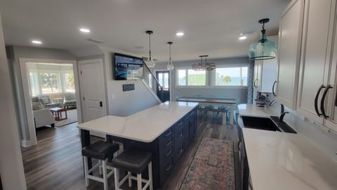 View from the back of the kitchen, you can see the family room and the large picture windows for your ocean view