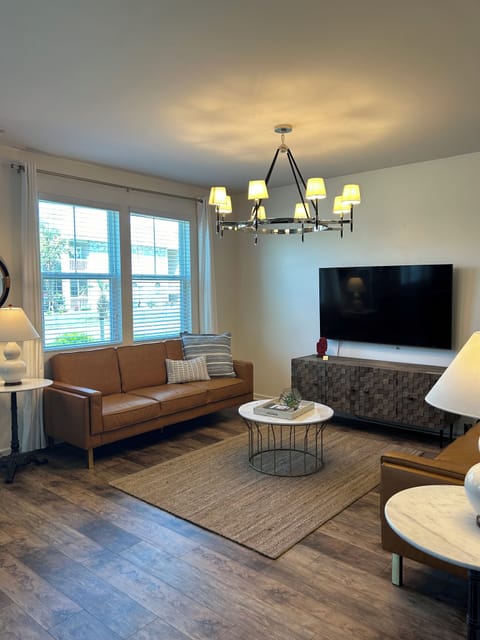 Spacious living room open floor lay out, leather sleeper sofas.