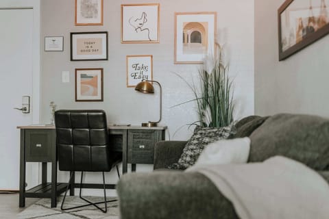Apt 2 has a cozy living room with a desk, sofa and HD TV.