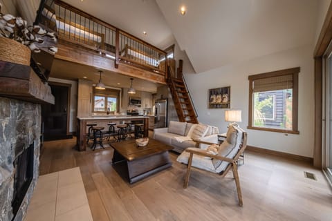 Bright living area with comfy seating and Smart TV