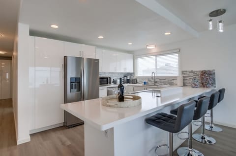 Mermaids Penthouse European High Gloss Kitchen with Quartz Countertop