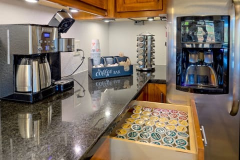 Wake up to a stocked coffee bar with multiple brew options and a wide selection of pods.