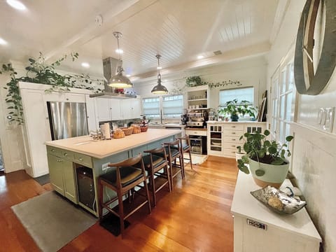 Shared kitchen stocked with plenty of spices and appliances for your use