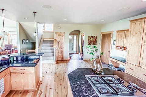 Kitchen with quick access to garage, front door, living/dining areas.