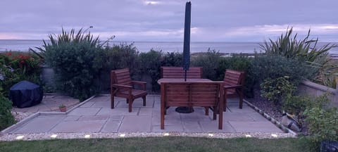 Large garden patio with BBW and fire pit