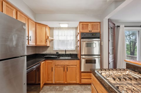 Private kitchen including cook top and 2 ovens for the chef in you!