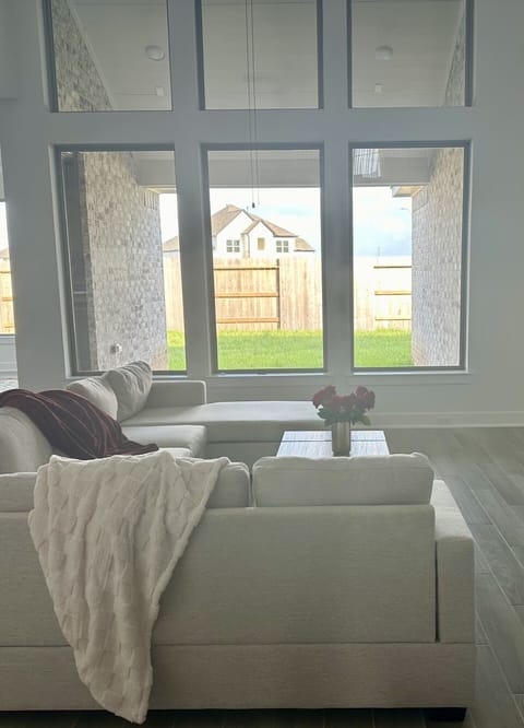 Family room with high ceilings, 70” tv and fireplace