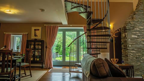 Spiral staircase and French doors leading to the garden