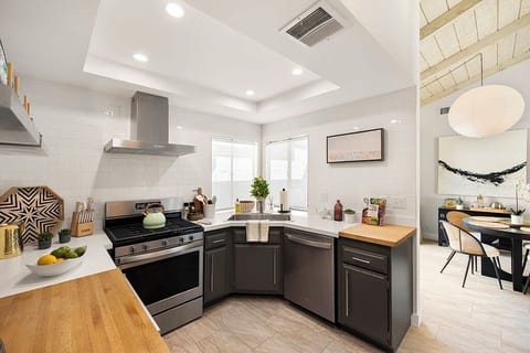 Refreshed kitchen with all new stainless steel appliances and wine frig.