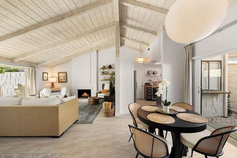 Dining area next to back patio with BBQ.