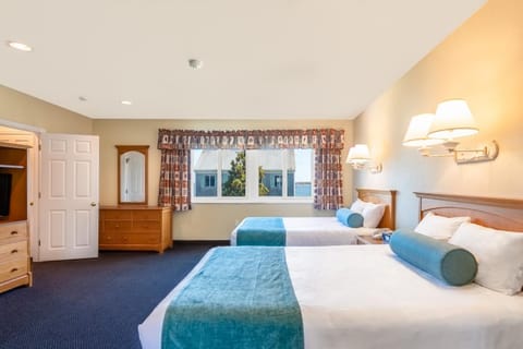 Stretch out on plush beds in a spacious, calm retreat.