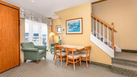 Enjoy casual dinners beside the balcony doors and coastal light.