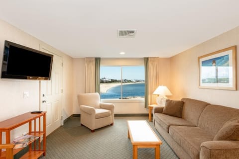 Unwind on the sofa with serene shoreline views ahead.