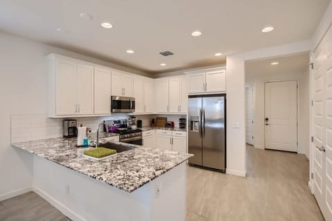 Enjoy the full kitchen and dining area with a refrigerator, freezer, oven, stove, microwave, dishwasher, coffee, creamers, mixers, spices, pots, pans, cooking supplies, cutlery, cups, plates, bowls, utensils, small appliances, and many more essentials.