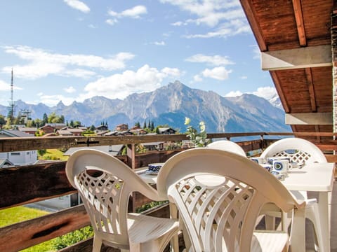 Cloud, Sky, Property, Furniture, Mountain, Wood, Outdoor Furniture, Building, Architecture, Leisure