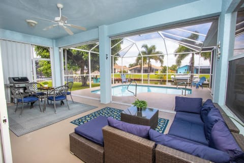 Whether relaxing or entertaining, the covered lanai with a sectional offers a front-row seat to poolside relaxation and water views