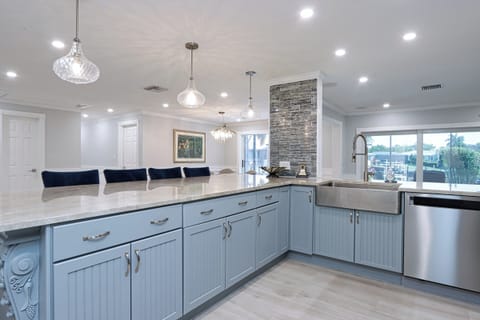 Kitchen with farmhouse sink and stainless steel appliances
