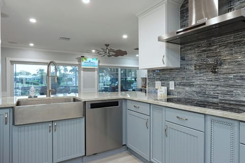 Kitchen with farmhouse sink and stainless steel appliances
