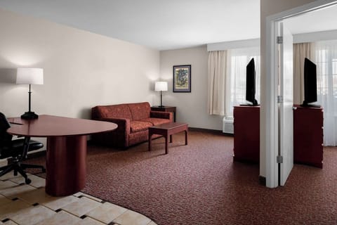 Unwind in the spacious suite lounge with work desk.