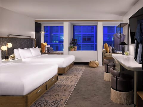 Settle in after sunset with spacious doubles and city glow.