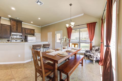 Dining area with bench seating; nearby the kitchen