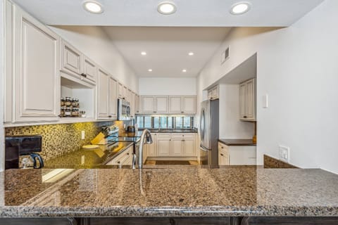 Oversized gourmet kitchen with granite counters