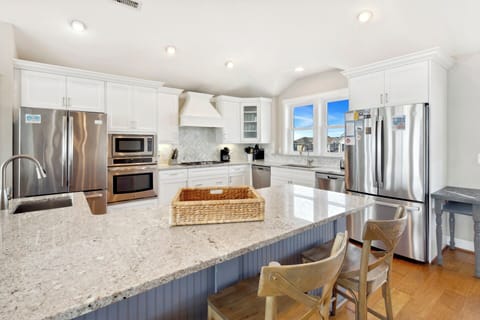 The fully equipped Kitchen has everything you need to prepare meals your family will love with two refrigerators, two dishwashers, two ovens, and a large breakfast bar with seating for six.